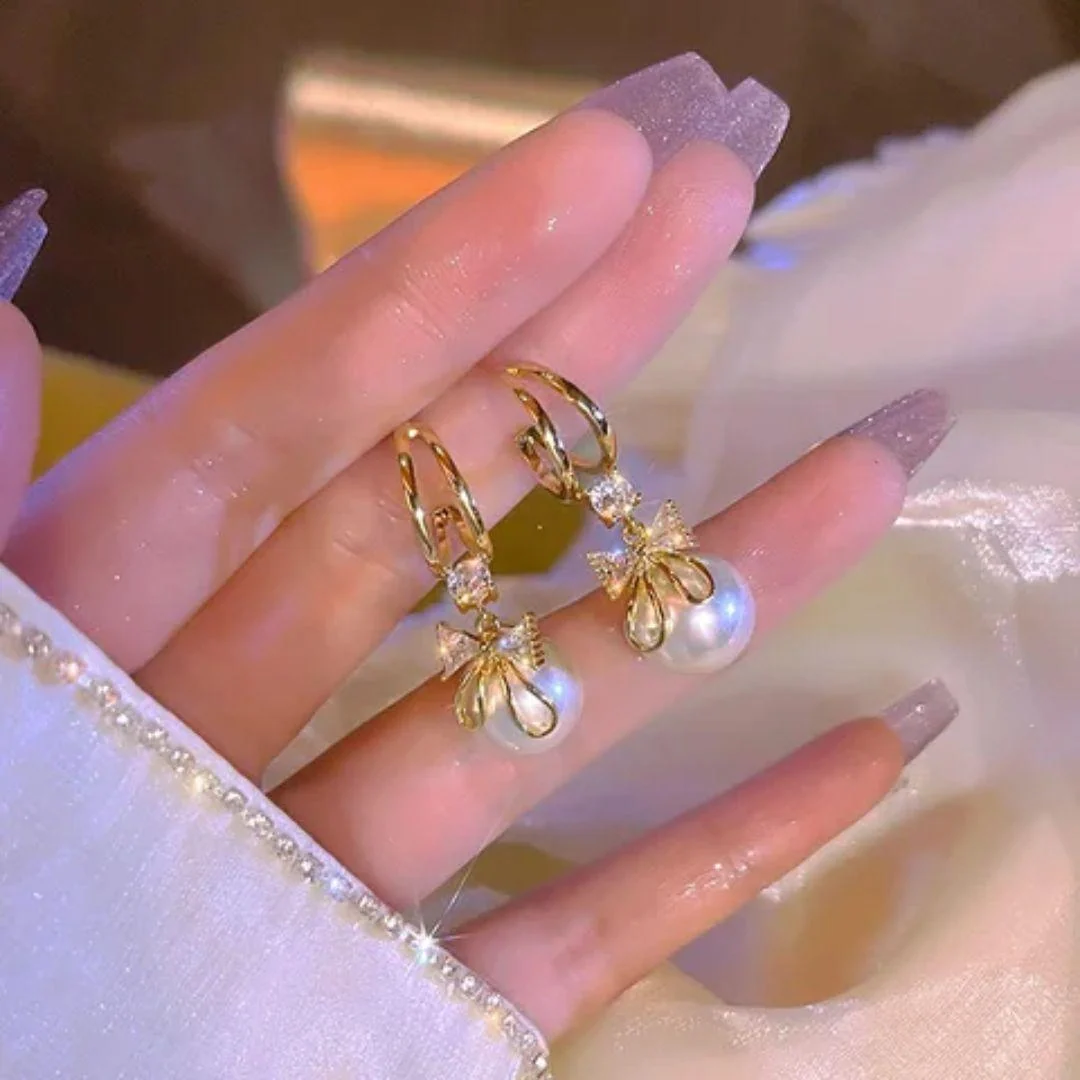 Perky Pearl Bow Earrings - midzumi